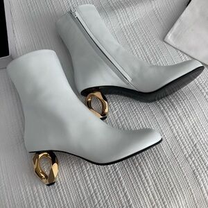 JW ANDERSON White Heeled Boots with iconic Gold Detail.